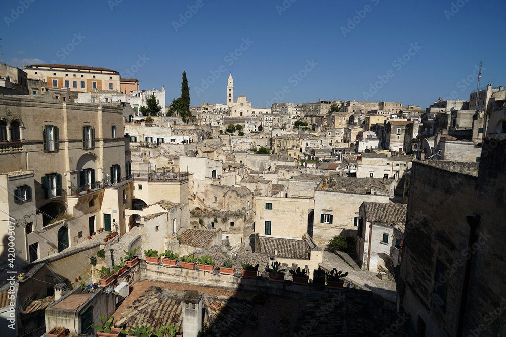 Sassi di Matera ancient site aerial panoramic cityscape, popular tourist travel place, guided tour concept, Basilicata, Italy
