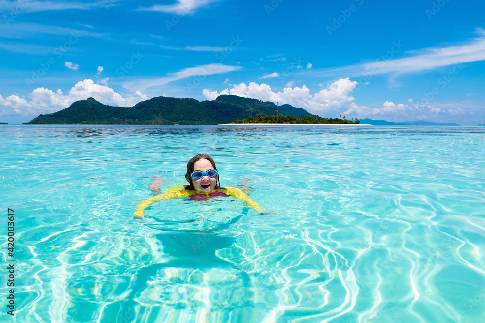 Kids snorkel. Children snorkeling in tropical sea.