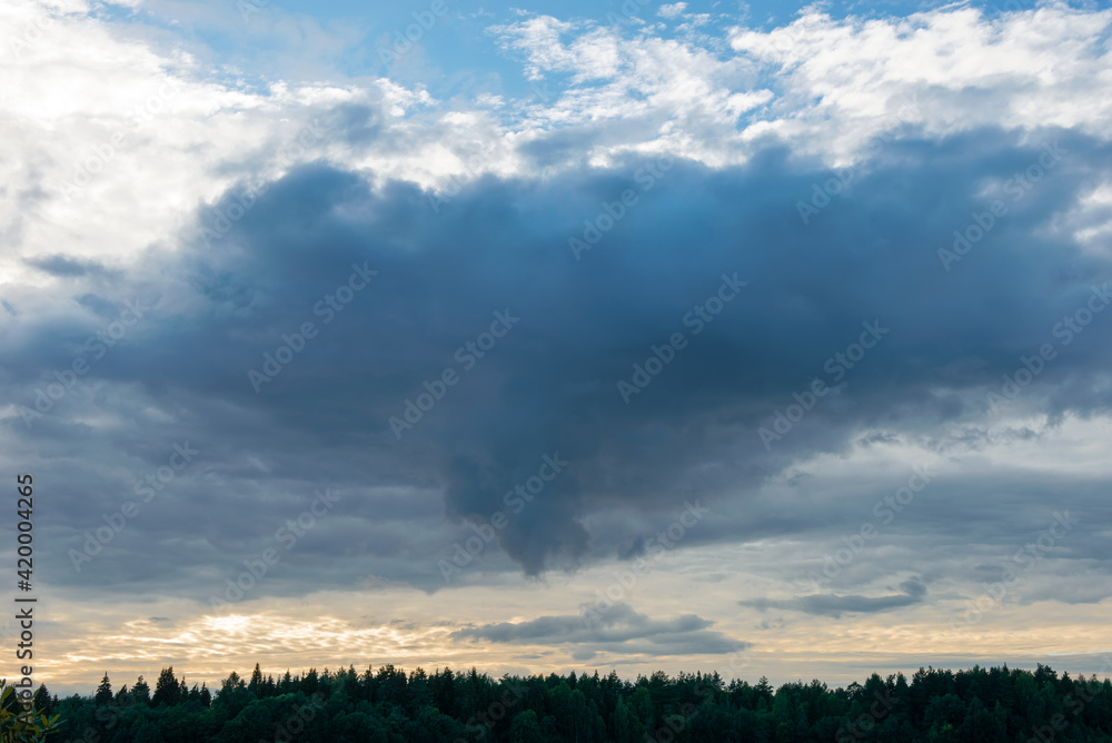 Before the rain. Thundercloud over an agricultural field on a summer evening Before the rain. Thundercloud over an agricultural field on a summer evening