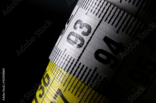 measuring tape on a black background