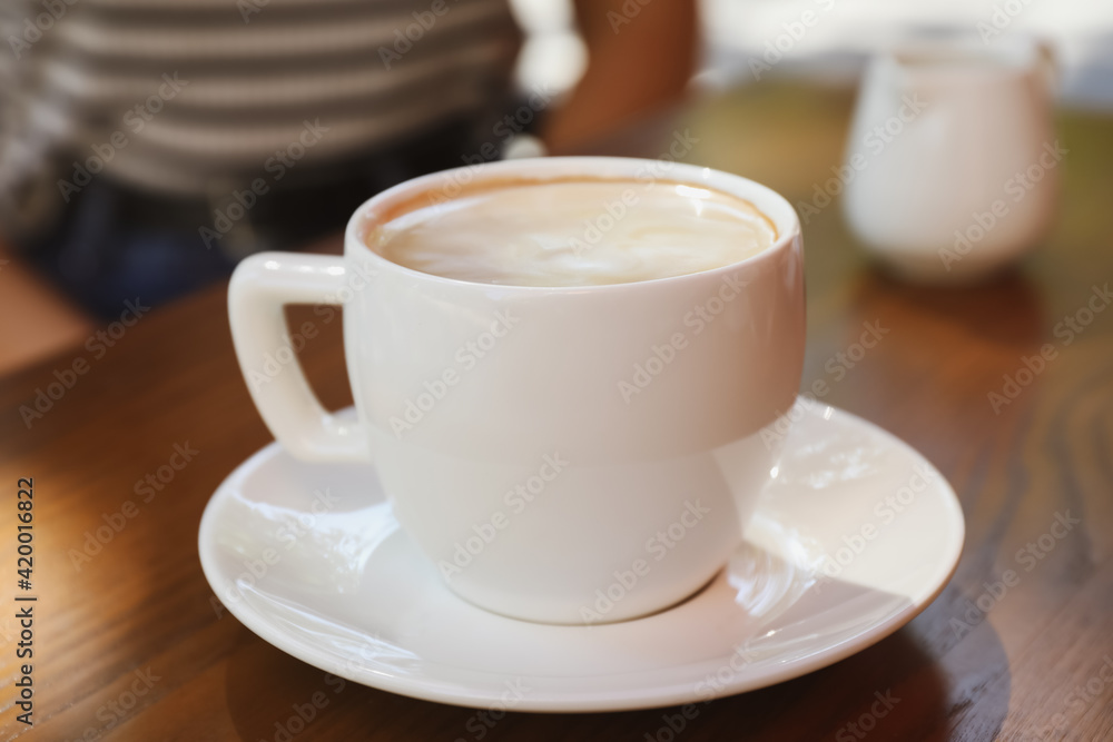 Aromatic coffee on wooden table outdoors, closeup Aromatic coffee on wooden table outdoors, closeup