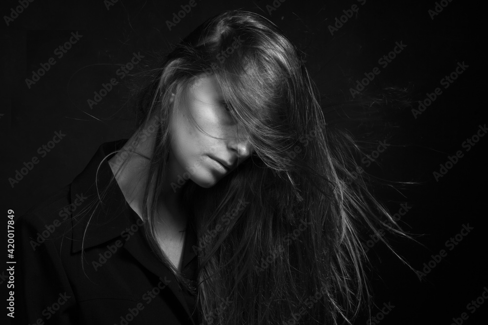Black and white portrait of a young girl with long hair Black and white portrait of a young girl with long hair