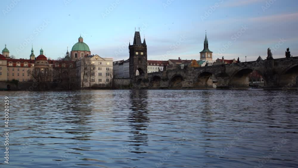 view of the old stone Charles Bridge on the Vltava River in the center of Prague in the early evening at sunset view of the old stone Charles Bridge on the Vltava River in the center of Prague in the early evening at sunset