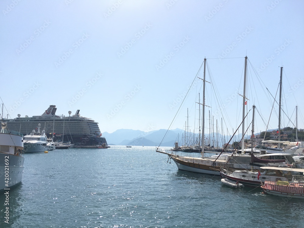 Fototapeta premium Marmaris harbor, Turkey with sailboats, ships and a large cruise ship