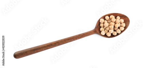 Wooden spoon with chickpeas on white background, top view. Natural food