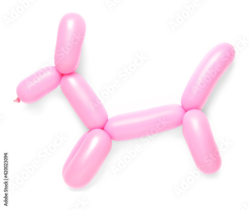 Pink dog figure made of modelling balloon on white background, top view