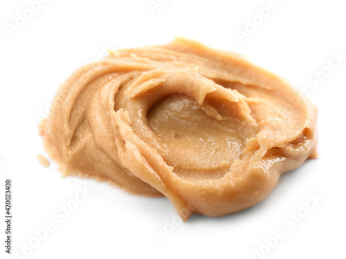 Delicious creamy peanut butter isolated on white