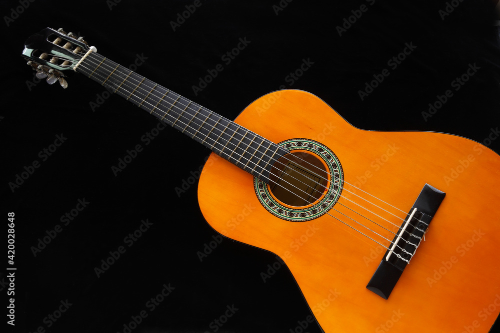 The guitar is a musical instrument that is used in a wide variety of musical styles. It typically has the six strings, but four, seven, eight, ten, and twelve string guitars also exist. The guitar is a musical instrument that is used in a wide variety of musical styles. It typically has the six strings, but four, seven, eight, ten, and twelve string guitars also exist.
