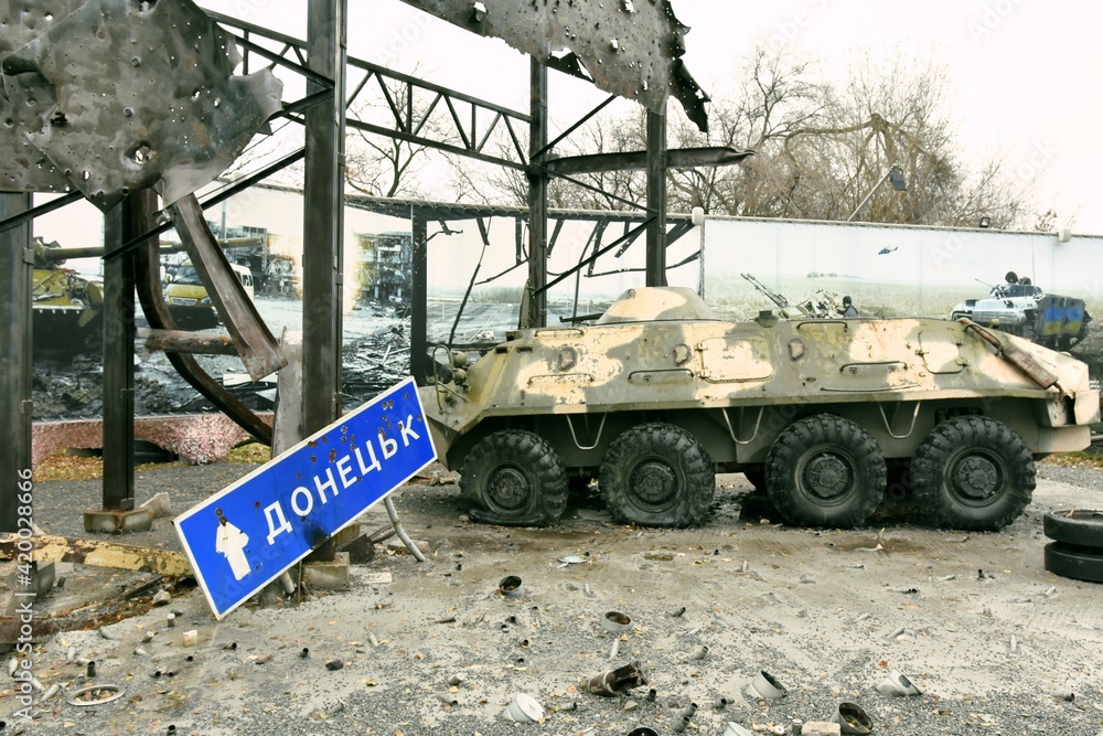 Donetsk city in Ukraine, armed conflict, military operations, Escalation in Donbas, vehicle wreck, armored,