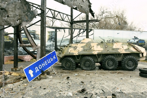 Obraz na płótnie Donetsk city in Ukraine, armed conflict, military operations, Escalation in Donbas, vehicle wreck, armored, w salonie