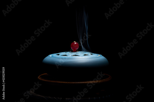 Fotografie, Obraz incense burner censer with smoke on black background.