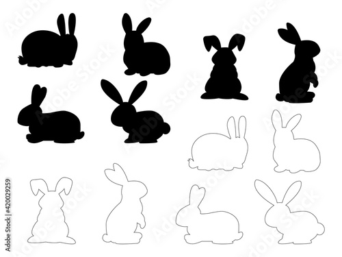 Fototapeta Naklejka Na Ścianę i Meble -  Set of Easter bunnies. Easter running, looking up and standing rabbits black silhouette. Black icons and outlines isolated on white background.
