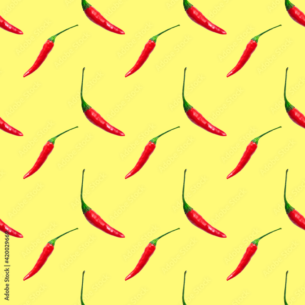 Small hot red chili peppers isolated on yellow background. Seamless pattern Small hot red chili peppers isolated on yellow background. Seamless pattern