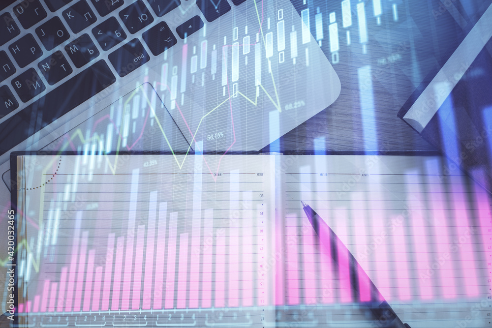 Stock market graph and top view computer on the table background. Multi exposure. Concept of financial education. Stock market graph and top view computer on the table background. Multi exposure. Concept of financial education.