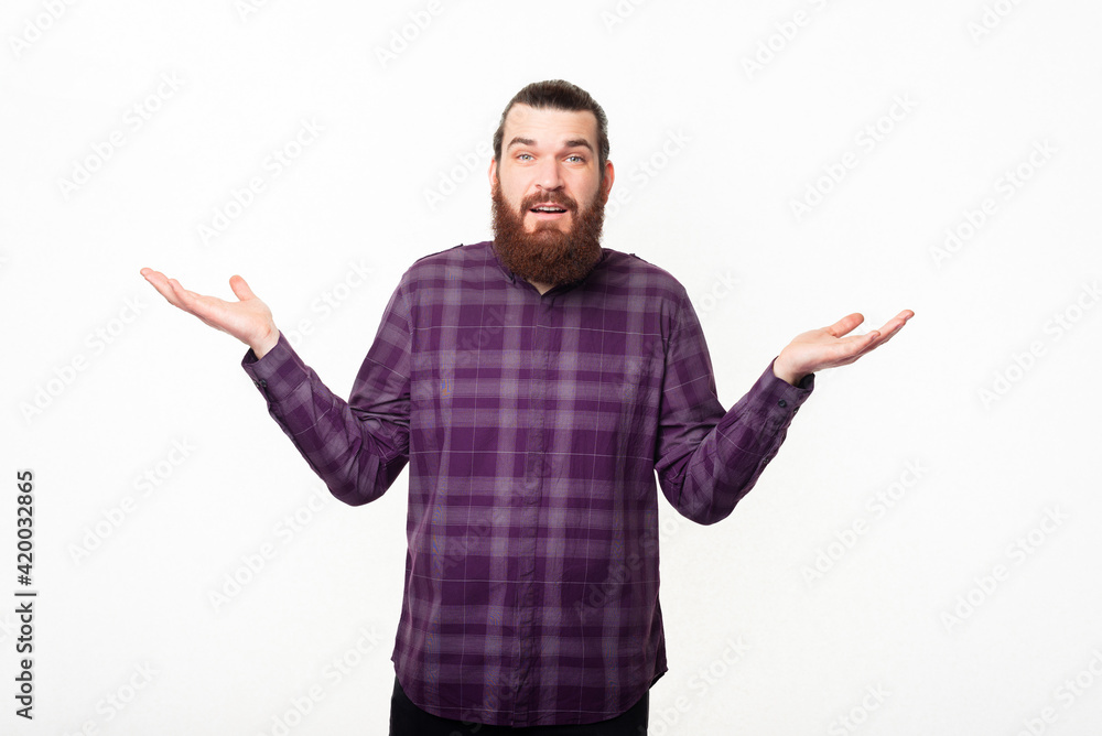 Confused bearded man gesturing dont know what to do Confused bearded man gesturing dont know what to do