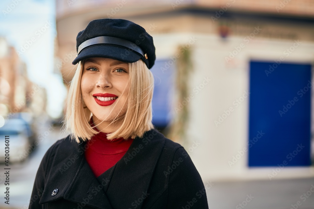 Young blonde woman smiling happy standing at the city. Young blonde woman smiling happy standing at the city.