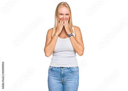 Принти на полотні Young blonde girl wearing casual style with sleeveless shirt laughing and embarr