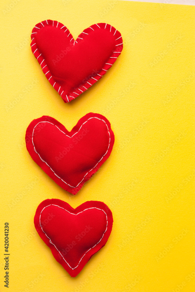 red heart valentine gift holiday romance yellow background