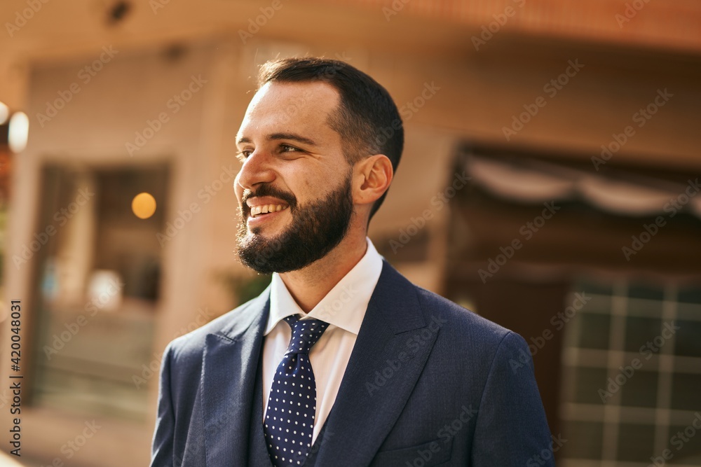 Young businessman smiling happy standing at the city. Young businessman smiling happy standing at the city.