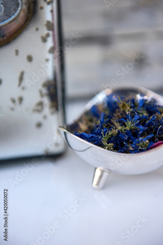 Fotografie Alternative Medicine, Health and Beauty, Blue Cornflowers in Silver Container