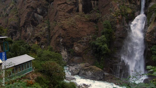 Chyamche, Nepal. Pan from restaurants and guest house to waterfall (October). (60 fps) photo