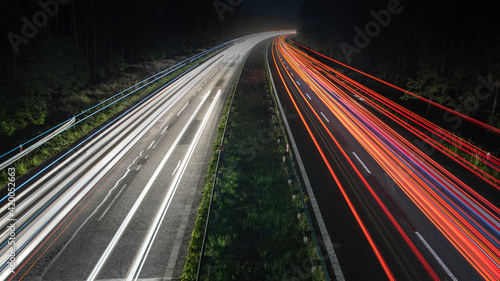 Truck light trails on highway. Art image . Long exposure photo taken on a highway © Andrzej Wilusz