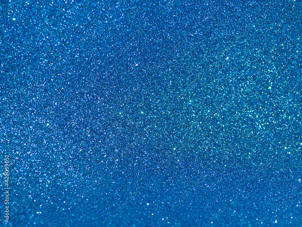 Obraz premium Blue background with bright sparkles. Party, celebration.