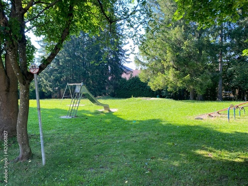 Playground with lawn and trees