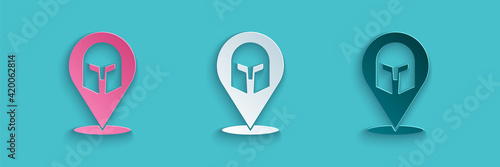 Paper cut Greek helmet icon isolated on blue background. Antiques helmet for head protection soldiers with a crest of feathers or horsehair. Paper art style. Vector
