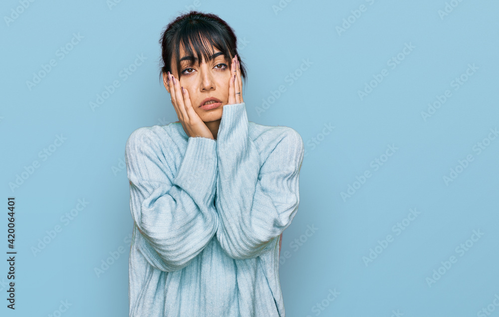 Young hispanic woman wearing casual clothes tired hands covering face, depression and sadness, upset and irritated for problem Young hispanic woman wearing casual clothes tired hands covering face, depression and sadness, upset and irritated for problem