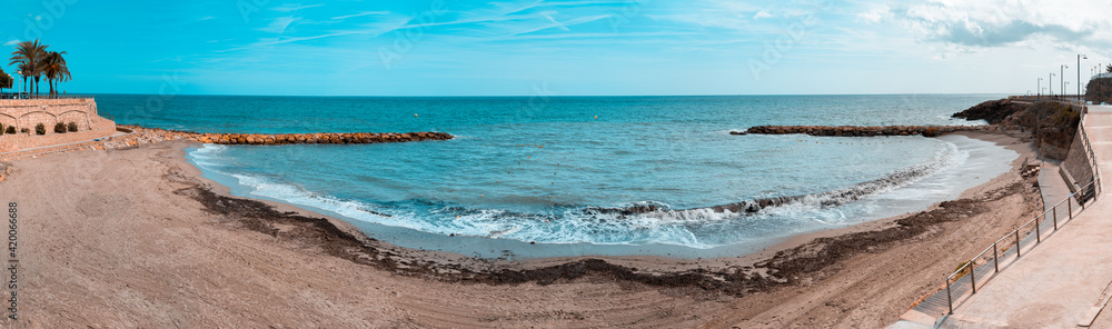 Panoramic view of a beach in the mediterranean village of Ametlla de mar, in Tarragona. Spain