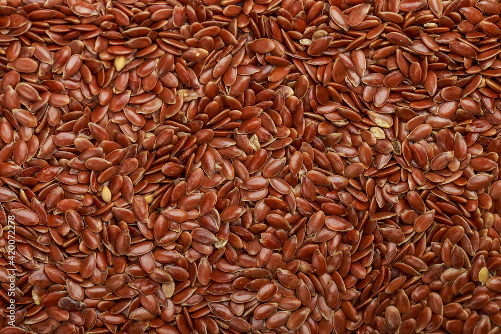 Flaxseed Culinary background. Flax seed close-up. Linseeds. Vegan and vegetarian cuisine. Top view, selective focus Flaxseed Culinary background. Flax seed close-up. Linseeds. Vegan and vegetarian cuisine. Top view, selective focus