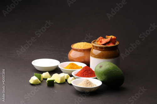 Homemade Mango Pickle or aam ka achar Kairi Loncha with Ingredients. photo