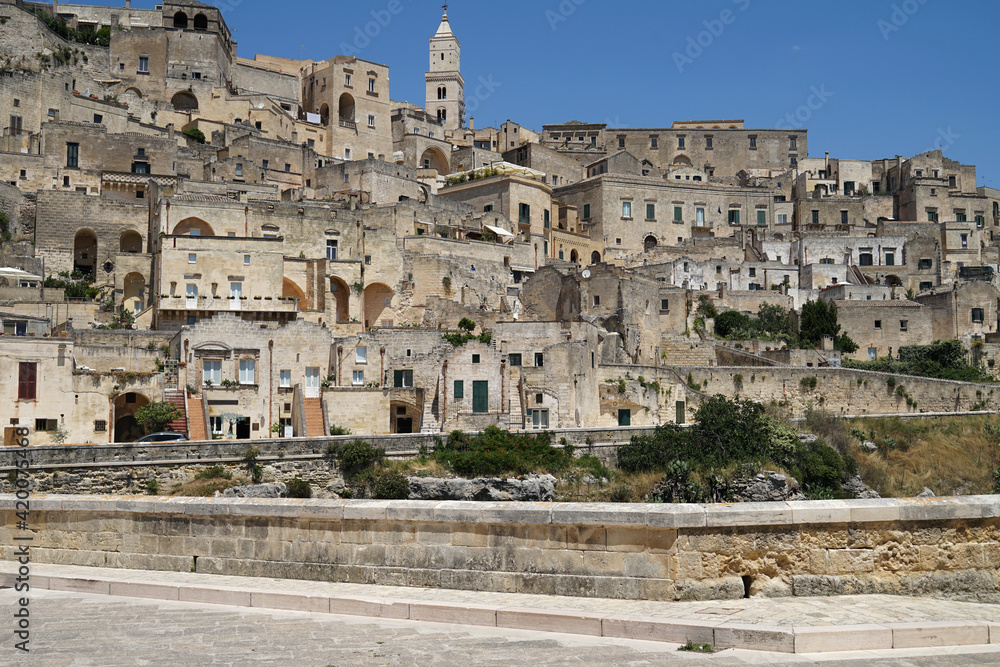 Sassi di Matera historic site aerial panoramic cityscape with cathedral on the hill, popular tourist travel place, guided tour concept, Basilicata, Italy