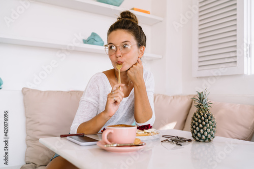 Content woman eating tasty food