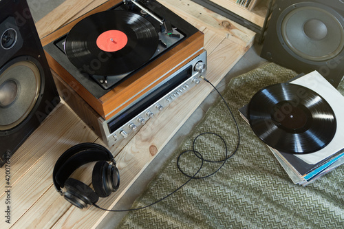 HiFi system with turntable, amplifier, headphones and lp vinyl records in a listening room photo