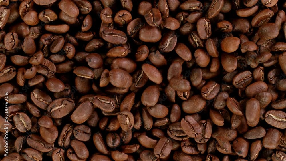 Super Slow Motion Shot of Moving Roasted Coffee Beans Super Slow Motion Shot of Moving Roasted Coffee Beans