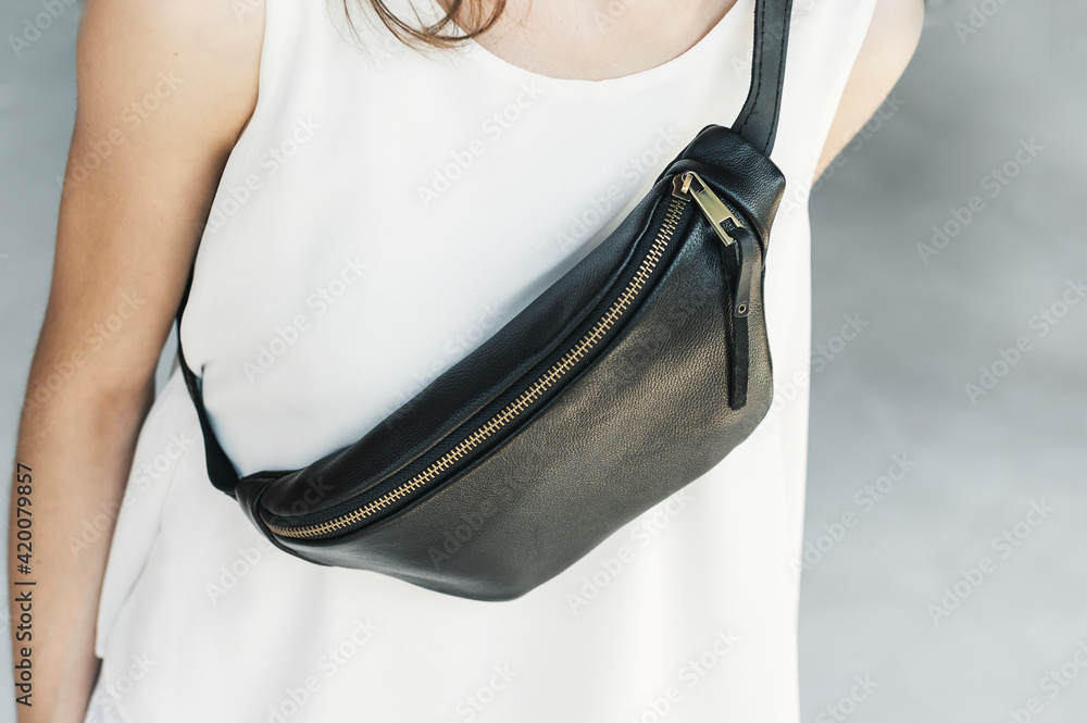 Leather Sling Purse Bum Bag Leather. Girl in a white t-shirt with a black  leather banana bag chest. Photos | Adobe Stock
