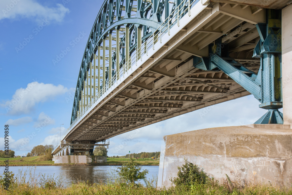 Iron Arch bridge over river IJssel near Dutch city Zwolle