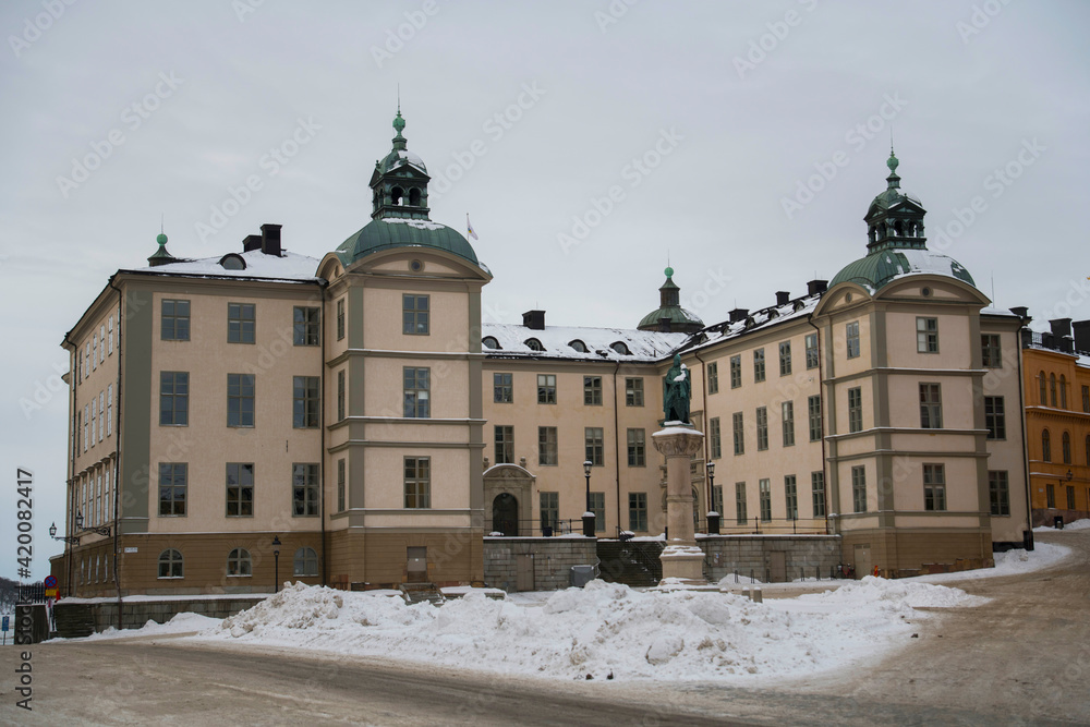 Old court house on the island Riddarholmen a snowy winter day in Stockholm 
