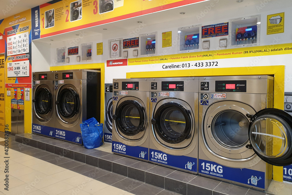 Modern Interior view of 24-hour self-service coin laundries and cloth ...