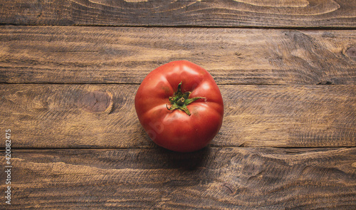 natural tomato on top of wooden table