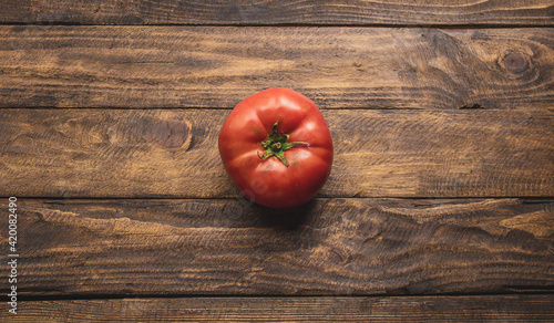 natural tomato on top of wooden table