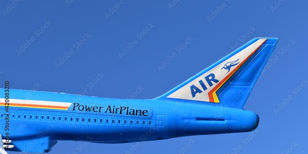 plastic toy plane isolated on a sky background. Power airplane. 