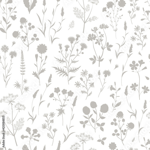 Meadow wildflower silhouette seamless vector pattern. Boho botanical floral neutral grey background. Delicate field flower and herb illustration.