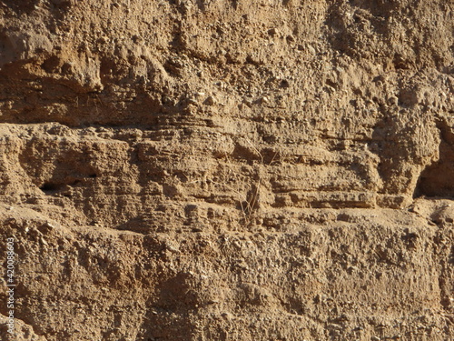 Deposition Strata in a Canyon Wash showing the Hydrology History of the River Bed Looking at the Size of the Layer Materials photo