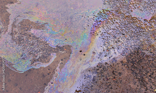 Photography Oil stain on Asphalt, color Gasoline fuel spots on Asphalt Road as Texture or Ba