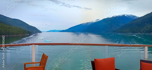 inside passage in Alaska for ship. view of mountain and ocean from a cruise ships open bar photo