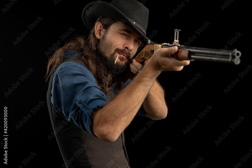 Cowboy with guns. Studio shooting Cowboy with guns. Studio shooting