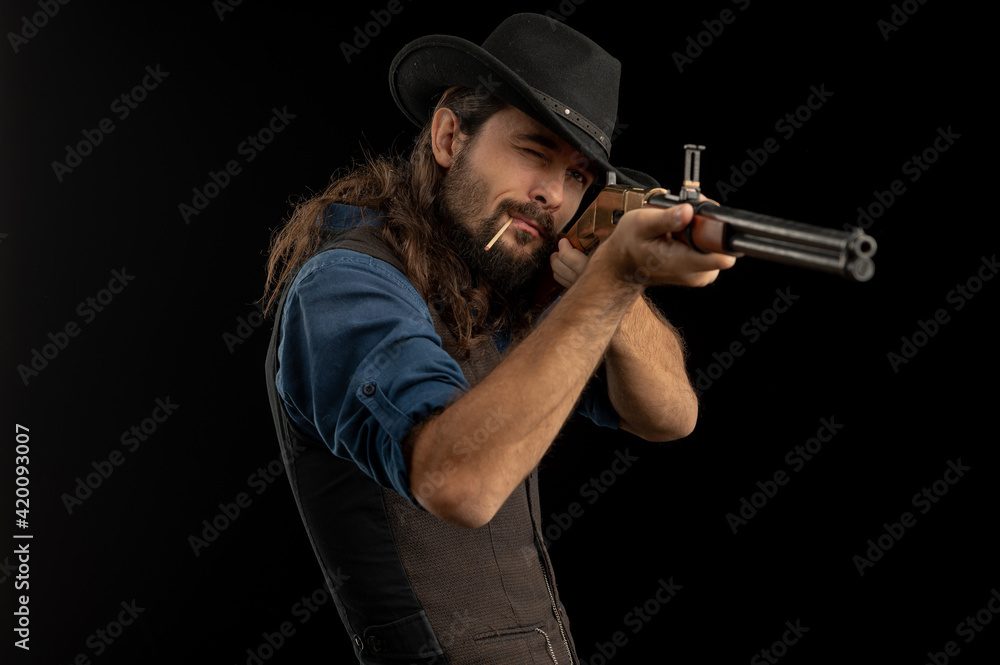 Cowboy with guns. Studio shooting Cowboy with guns. Studio shooting